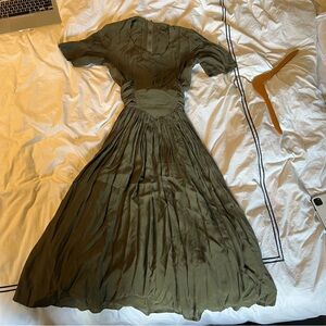 Vintage beautiful green dress with bow in the back 
Fits size 6